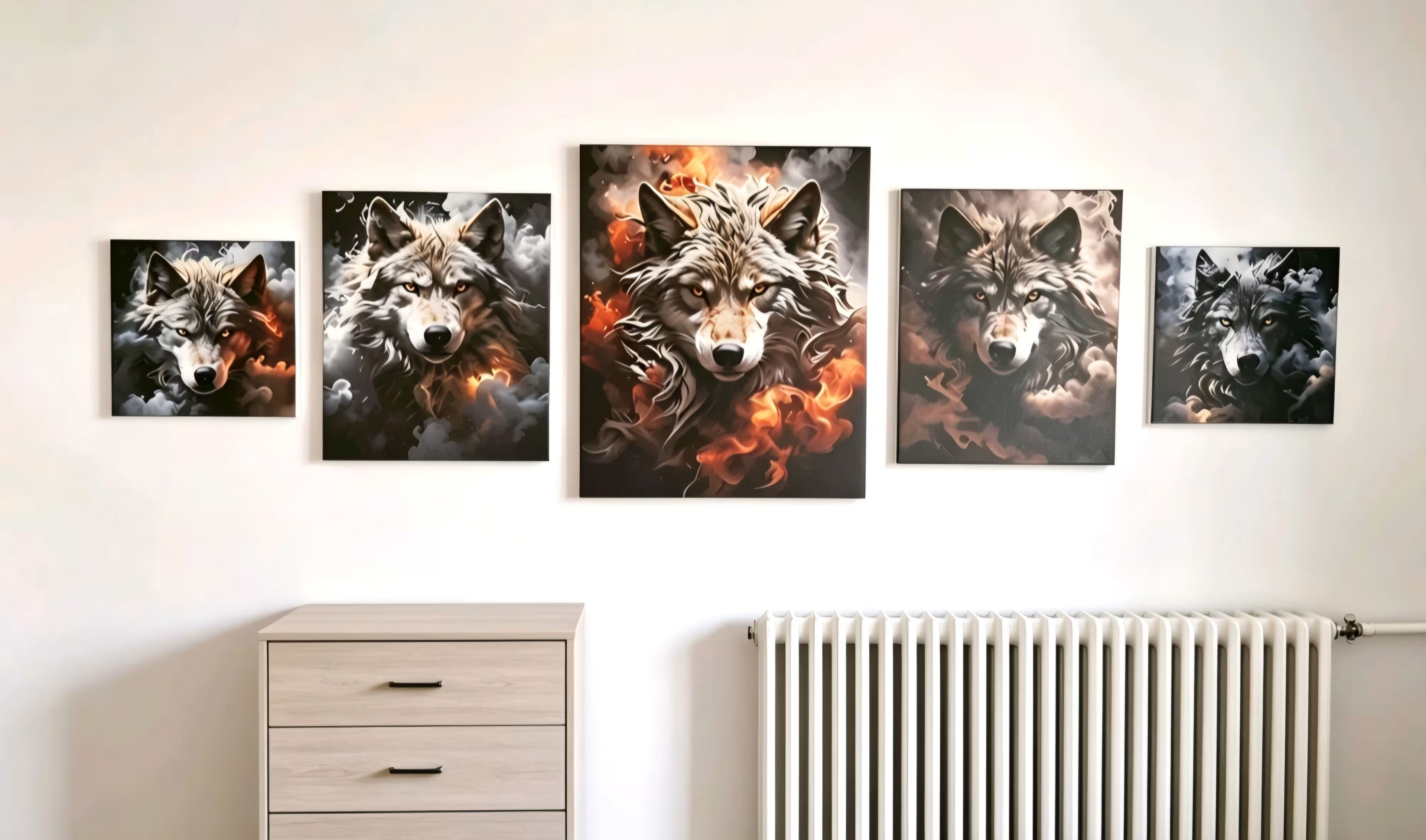 A set of five wolf art prints displayed in a row on a white wall above a light wood dresser and a white radiator. The prints feature highly detailed, dramatic wolf portraits with fiery orange and black tones.