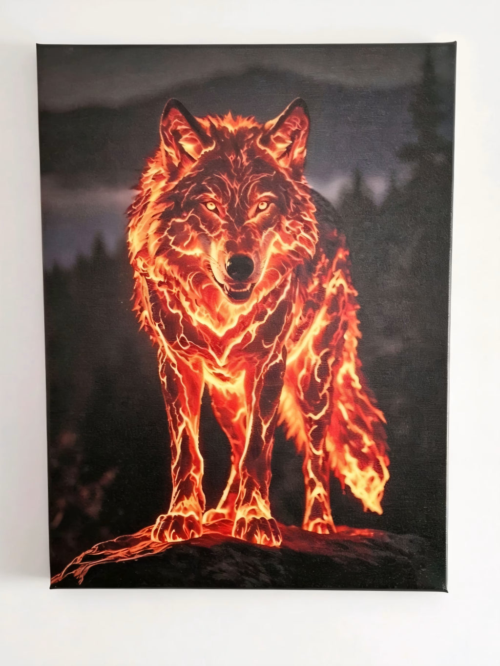 A vertical canvas wall art print depicting a glowing, fiery wolf standing on a dark forest background at night.